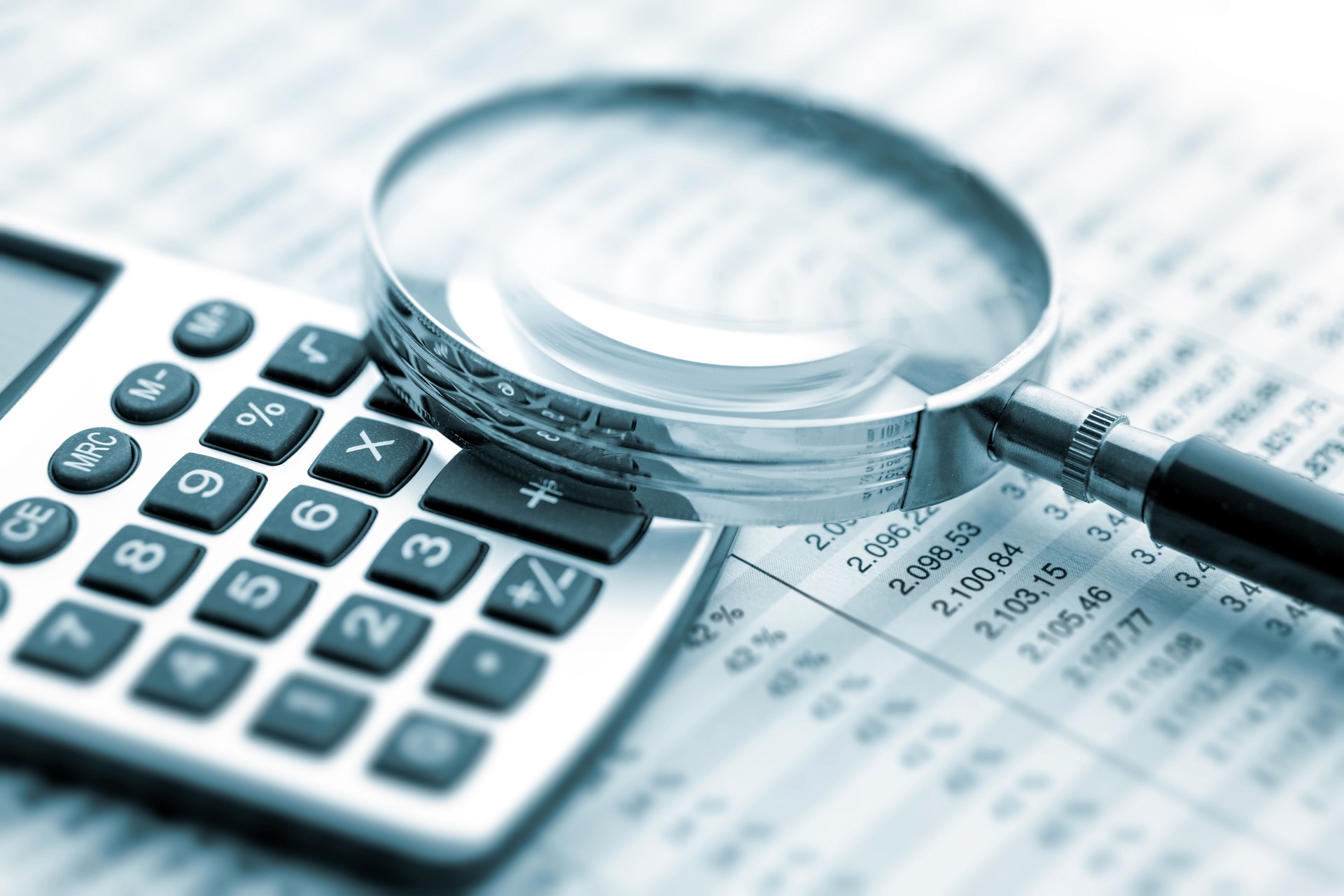 Magnifying glass on financial chart